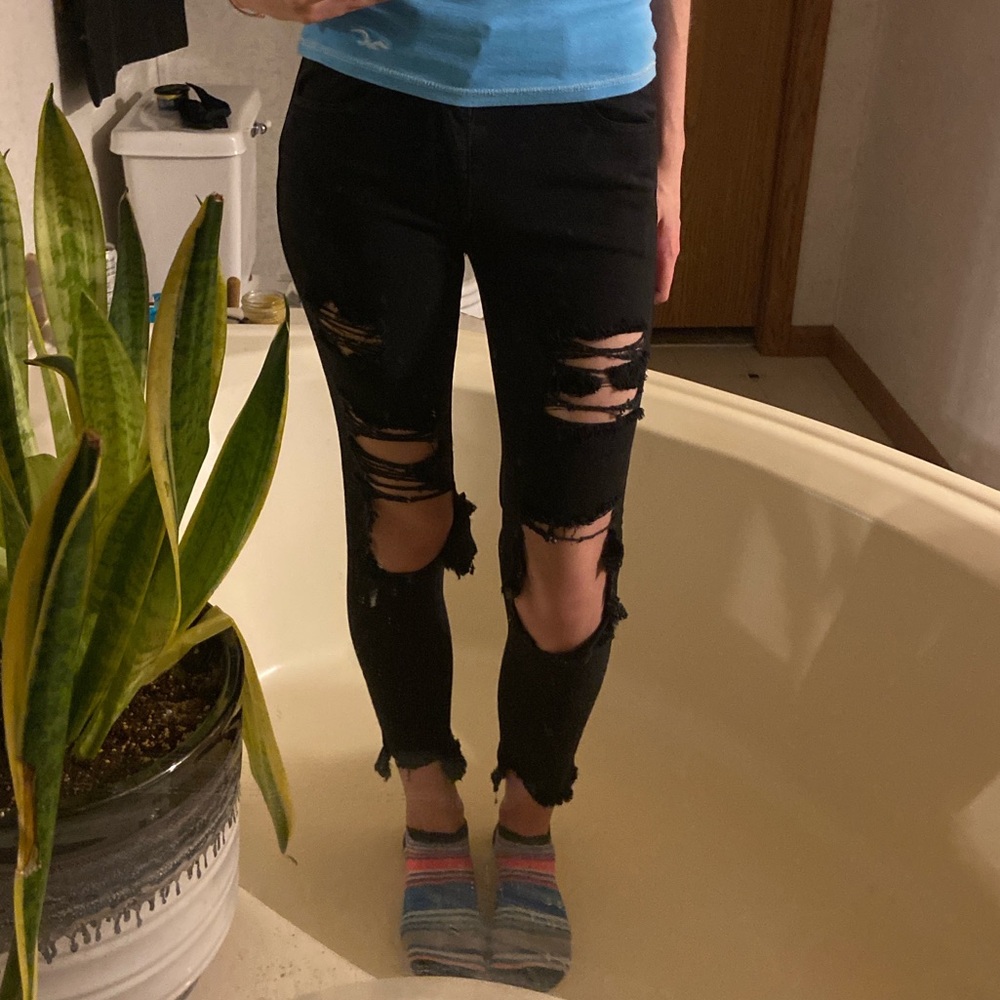 super stretchy ripped black mid-rise american eagle jeans